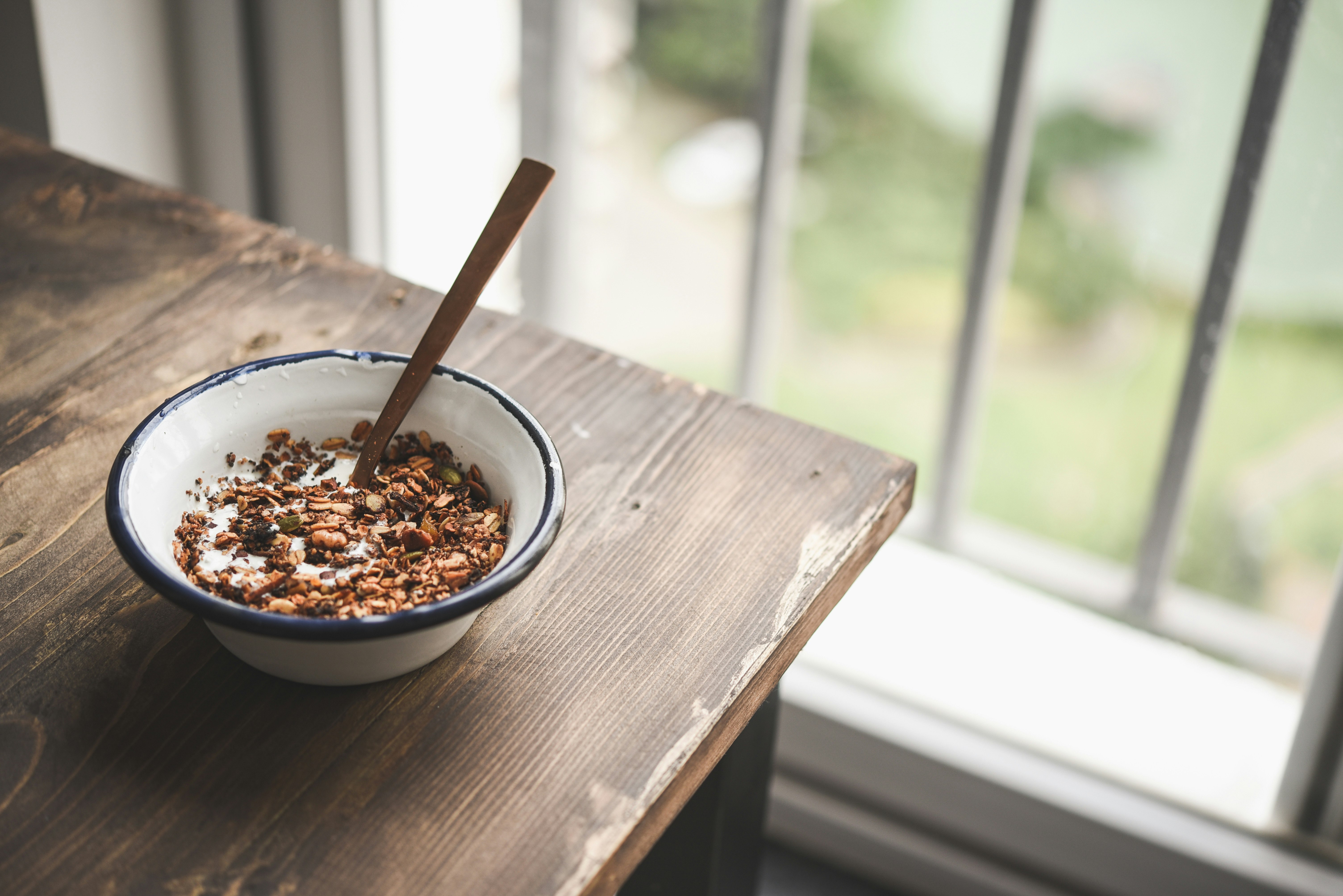 brown wooden chopsticks on white ceramic bowl